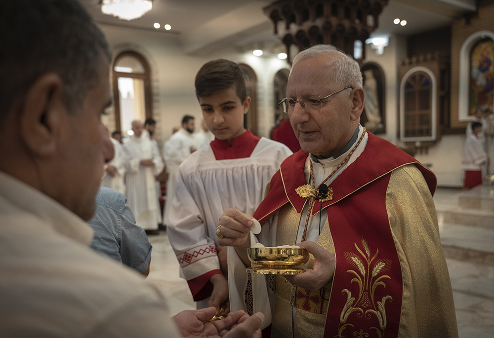 Chaldean Patriarch Louis Sako holds service at Mar Youssef Cathedral July 30, 2023, in Irbil, Iraq. In 2023 The Iraqi government revoked a decree that formally recognized Sako's religious status. Sako fled the capital for the autonomous Kurdistan region. (AP photo/Julia Zimmermann/Metrography)