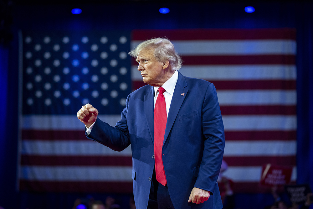 Former President Donald Trump pumps his fist as he departs after speaking at the Conservative Political Action Conference on March 4, 2023, at National Harbor in Oxon Hill, Maryland. (RNS/AP/Alex Brandon)