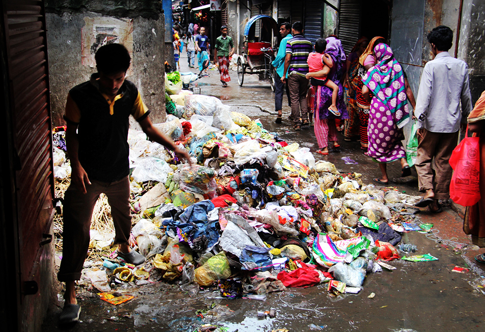 During the monsoon season, water accumulates in the camp, and there is no designated place to dump garbage, and garbage is left on the road. In the camp, each family with eight to 10 members on average lives in one room, and around 90 people share a latrine. (Stephan Uttom Rozario)