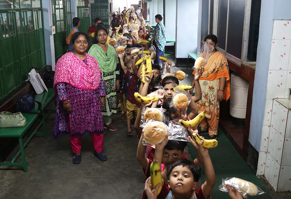 In 1972, the Congregation of Our Lady of the Missions Sisters started the S.F.X. Greenherald International School near the Bihari camp. They started the Green Herald Evening Charity School program for Bihari children in 1982. After class, the sisters provide students with tiffin. (Stephan Uttom Rozario)