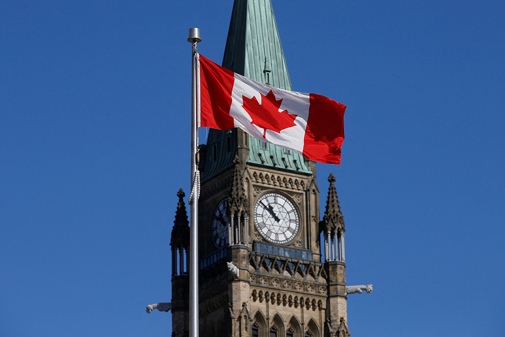 A Canadian flag flies in front of the Peace Tower on Parliament Hill in Ottawa, Ontario, Canada, March 22, 2017. (OSV News/Reuters/Chris Wattie)