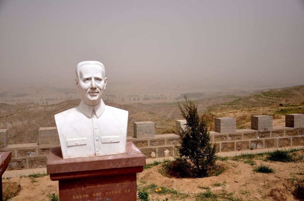 A bust at China's Nihewan Museum celebrating Jesuit Fr. Pierre Teilhard de Chardin overlooks the vast valley still under excavation.