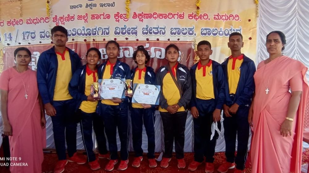 14.	St. Joseph of Chambery Sr. Vijayakumari Anthony Sami (far left) and Sr. Lynette Lopes (far right) with the winners of an inter-school sports match. 