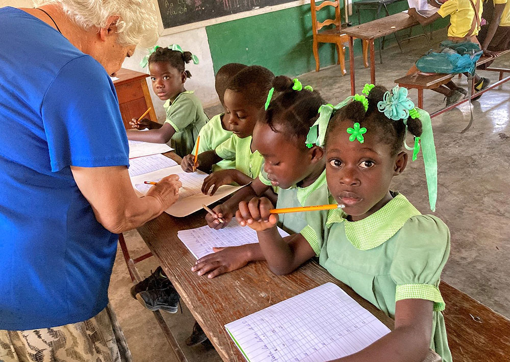 Sr. Rosario Fumnal, a member of the Religious of Jesus and Mary from Spain, teaches preschool students in Haiti. (Patricia Dillon)