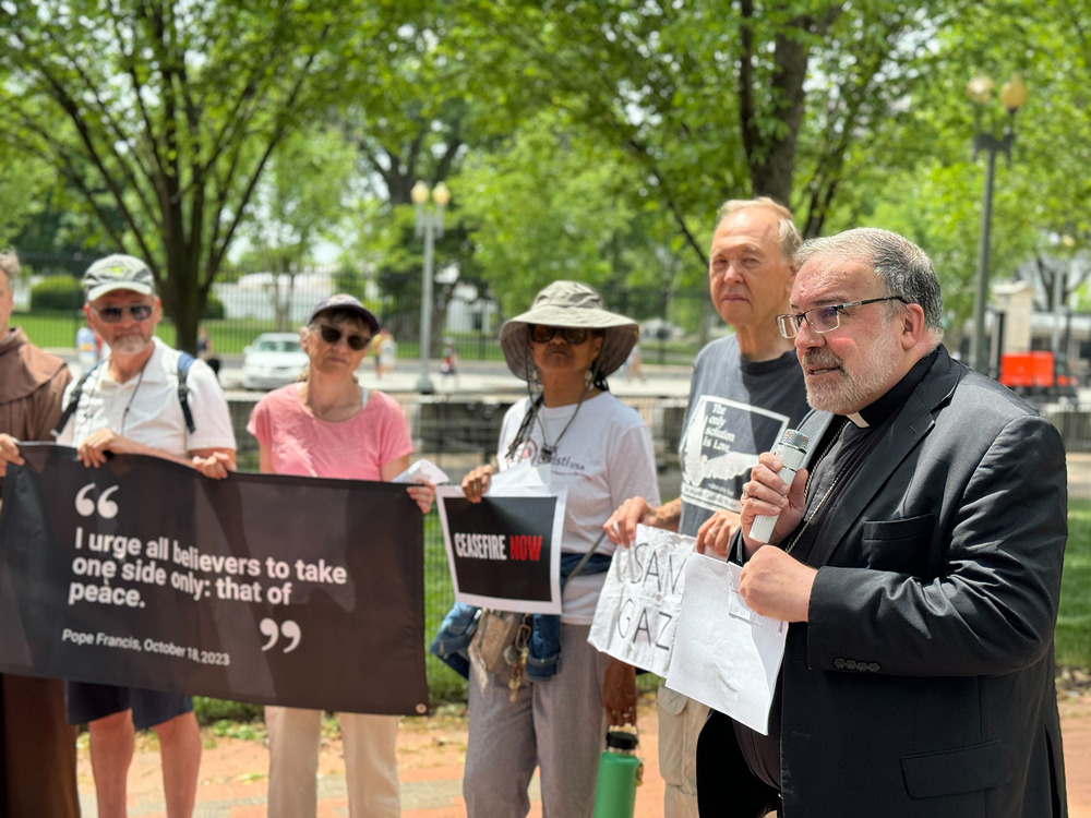 Bishop John Stowe of Lexington, Kentucky speaks to demonstraters