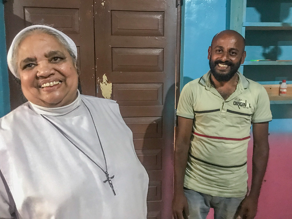 Apostolic Carmel Sr. Maria Amali shares a lighter moment with the father of a kindergarten student at her convent in Pussellawa, Sri Lanka. (Thomas Scaria)