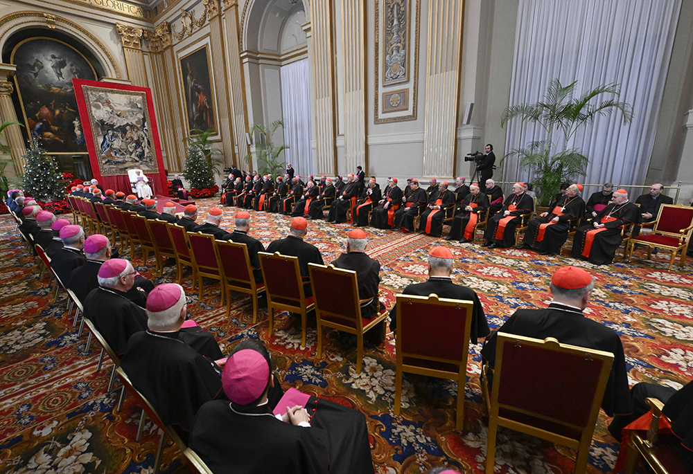 Pope Francis speaks to cardinals and top officials of the Roman Curia in the Vatican's Hall of Blessings Dec. 21, 2023. In his traditional pre-Christmas speech, the pope focused on the need for Curia officials to learn to listen and discern as they help the church move forward. (CNS/Vatican Media)