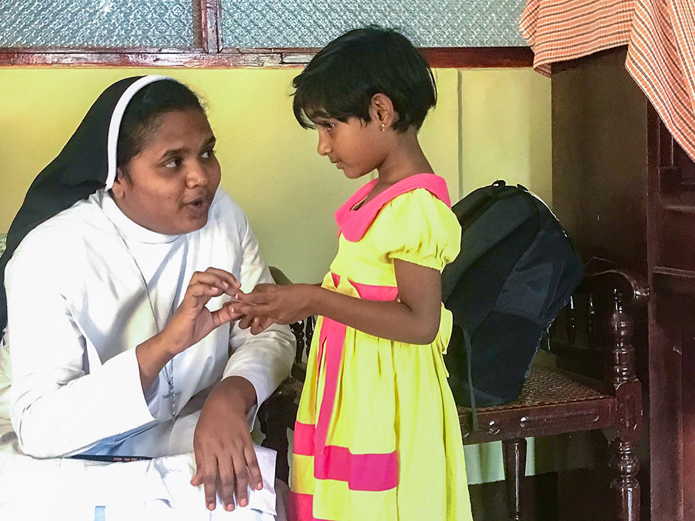 Apostolic Carmel Sr. Maria Ebisagini with a student of the Montessori school that is managed by her congregation for tea plantation workers' children at Pussellawa, Sri Lanka (Thomas Scaria)