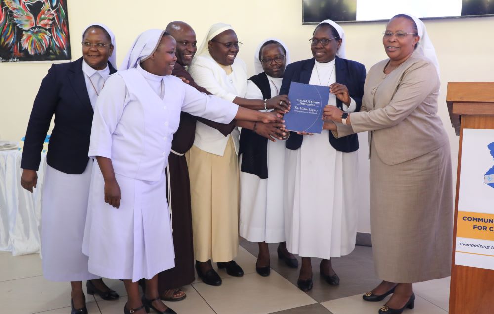 Sr. Jane Wakahiu (right) and religious sisters participated in the launch of the Communications Network for Catholic Sisters in Nairobi, Kenya, on June 14. Wakahiu holds a book that outlines a code of conduct for sister communicators and resources to help them improve their journalistic skills. (Courtesy of AOSK)