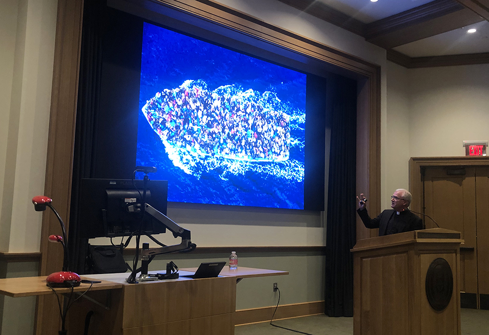 Holy Cross Fr. Dan Groody, an expert on migration and refugees, gives a talk at the University of Portland June 12. To inform his understanding of migration, Groody has traveled to some 50 countries and spoken to migrants, Border Patrol agents, nurses, politicians and bishops. (NCR photo/Katie Collins Scott)