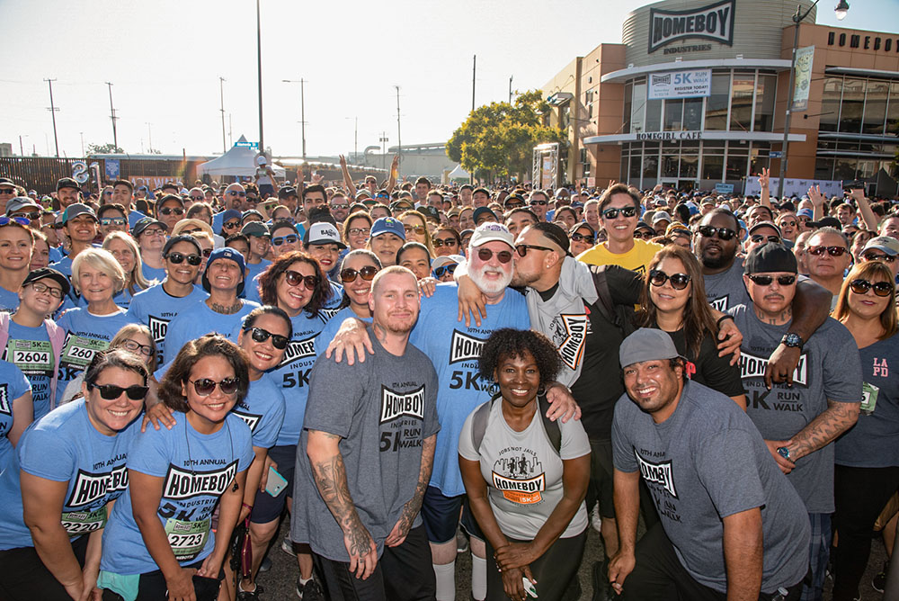 Jesuit Fr. Greg Boyle is seen with some of his trainees during a 5k race at Homeboy Industries in Los Angeles in 2020. (Courtesy of Paul Steinbroner)