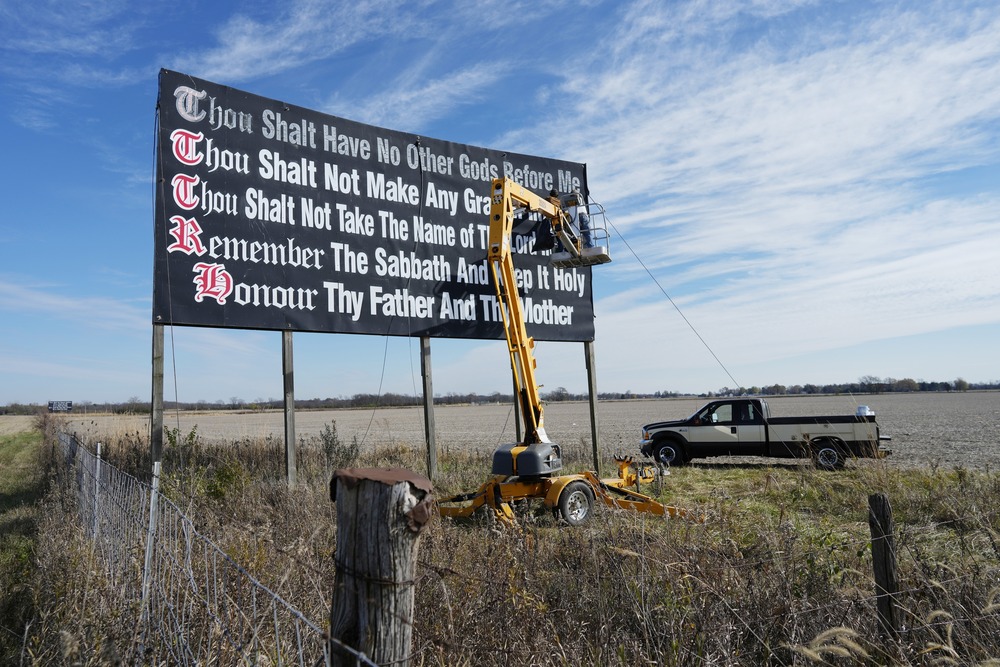Ten Commandments billboard Billboard in field pictured against wide, blue sky.