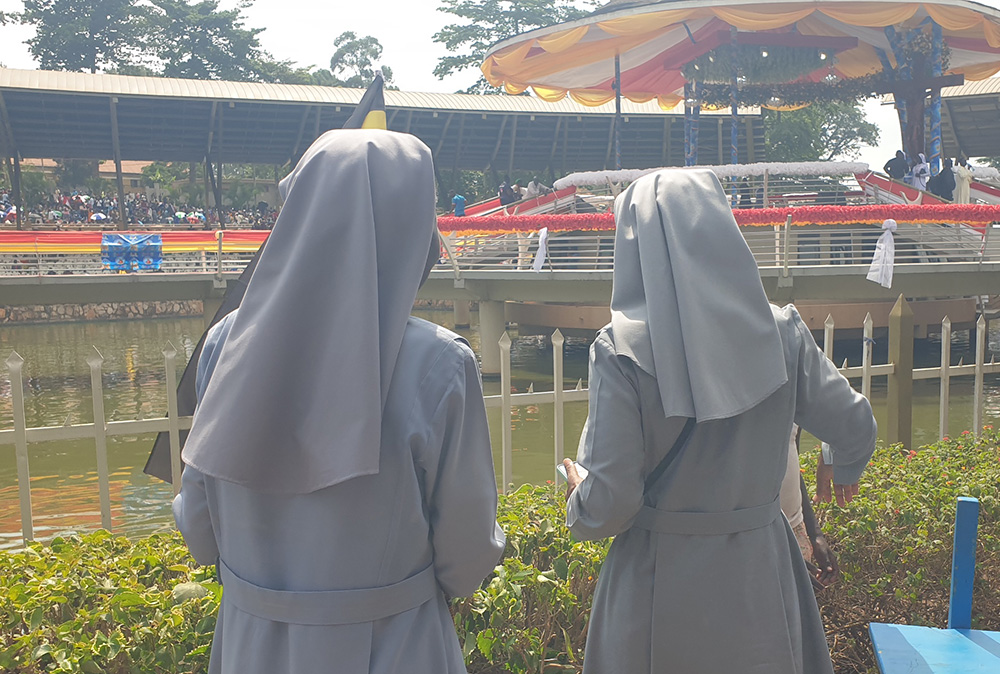 Catholic sisters pray at the holy well in Namugongo in Kampala, Uganda's capital, hours before the commemoration of Martyrs' Day on June 3, 2024. The water comes from the Mukajanga well — named after the chief executioner — and is believed to be holy. (GSR photo/Gerald Matembu)