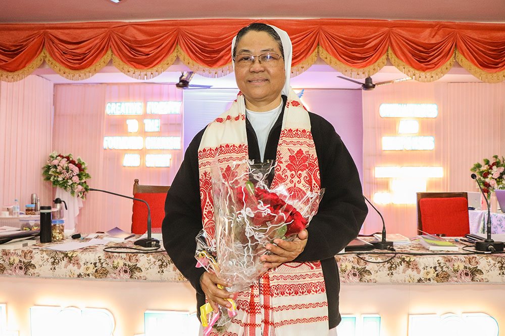 Sr. Christine Mynsong, newly elected superior general of the Missionary Sisters of Mary Help of Christians in northeastern India, is congratulated with a local Assamese shawl. (Courtesy of Missionary Sisters of Mary Help of Christians)