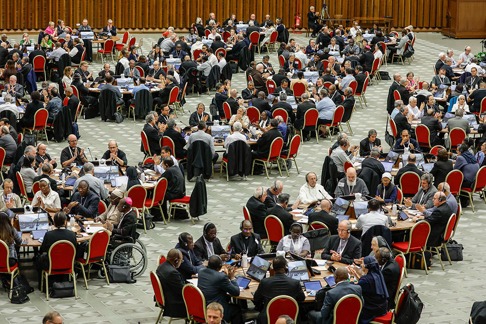 Members of the assembly of the Synod of Bishops start a working session in the Vatican's Paul VI Audience Hall Oct. 18, 2023. (CNS/Lola Gomez)