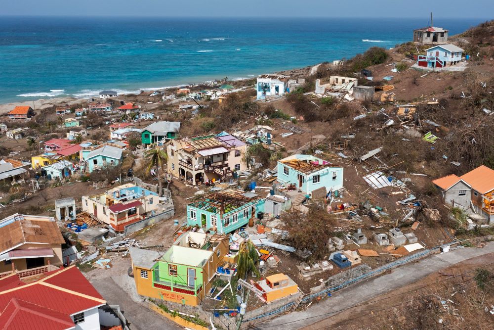 Scattered debris and houses with missing roofs are seen in a drone photograph July 2, 2024, after Hurricane Beryl passed the island of Petite Martinique, Grenada. (OSV News/Reuters/Arthur Daniel)