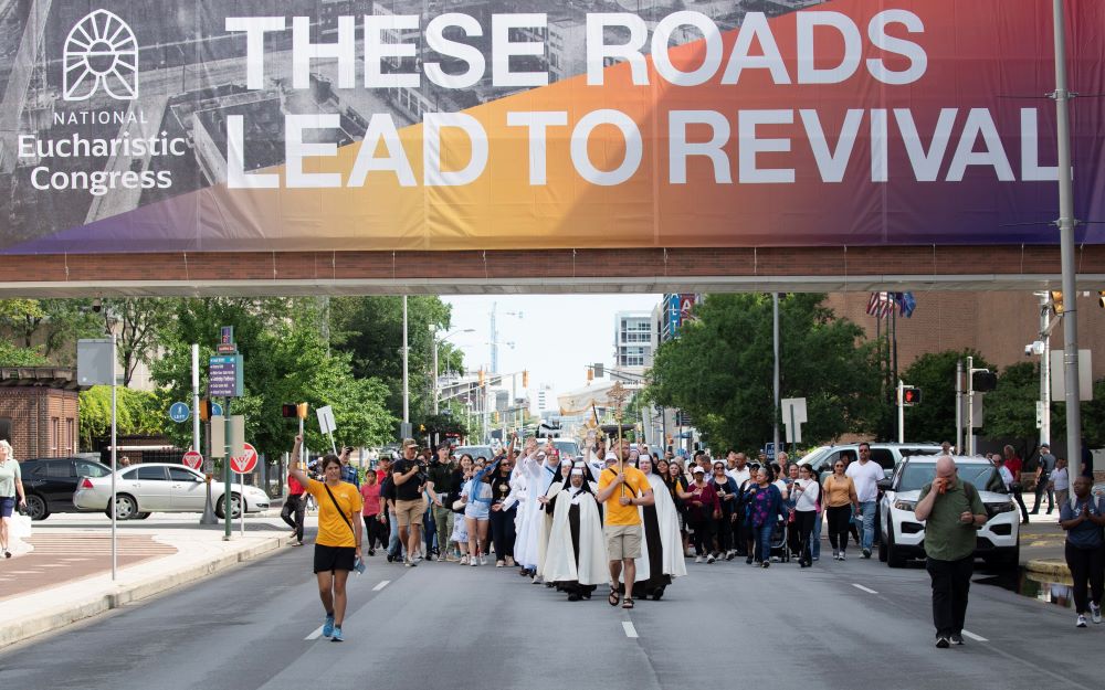 Pilgrims on the final leg of the National Eucharistic Pilgrimage's Seton Route, which launched May 18 in New Haven, Conn., arrive for a welcome Mass at St. John the Evangelist Church in Indianapolis July 16, ahead of the National Eucharistic Congress. (OSV News/Bob Roller) Pilgrims on the final leg of the National Eucharistic Pilgrimage's Seton Route, which launched May 18 in New Haven, Conn., arrive for a welcome Mass at St. John the Evangelist Church in Indianapolis July 16, ahead of the National Eucharistic Congress. (OSV News/Bob Roller)