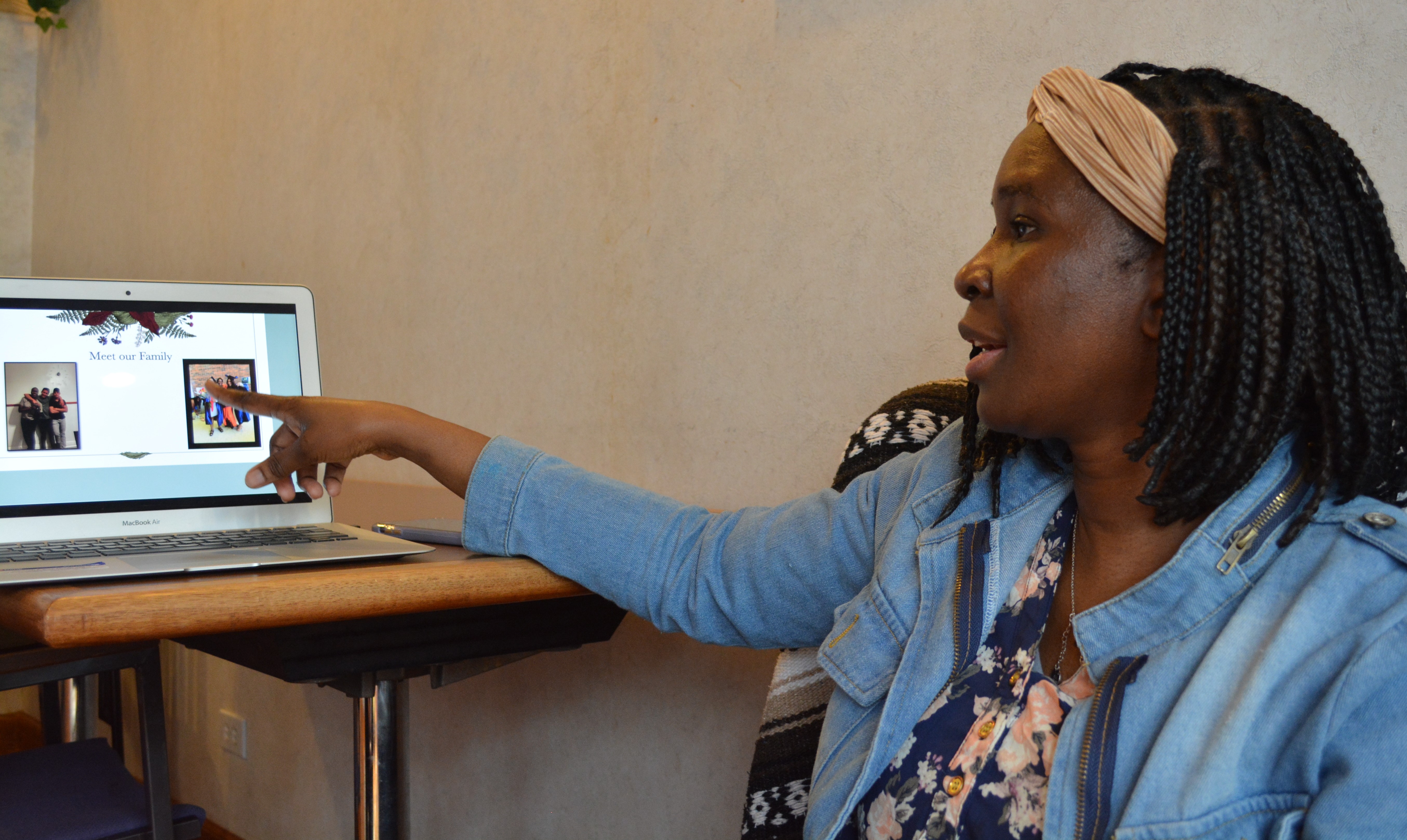 Franciscana Clarisa Sr. Stella Akello, intake officer at Bethany House of Hospitality in Chicago, shows a slideshow of her home life May 7. 