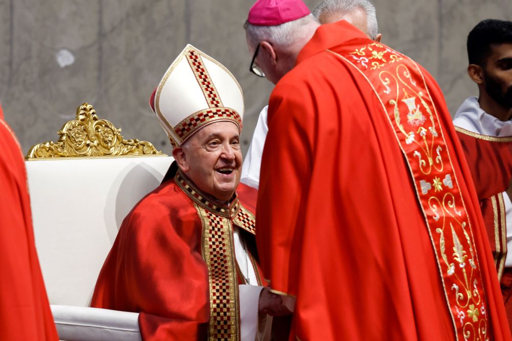Pope Francis gives the pallium to Archbishop Christopher Coyne of Hartford, Connecticut, during Mass for the feast of Sts. Peter and Paul in St. Peter's Basilica at the Vatican June 29, 2024.