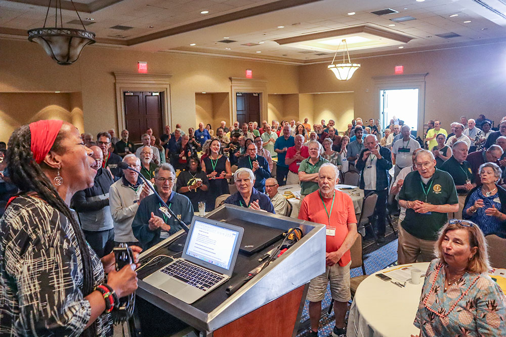 Kim Harris leads attendees in song during her keynote address at the 13th Annual Assembly of the Association of U.S. Catholic Priests June 26 in Lexington, Kentucky. (Paul Leingang)