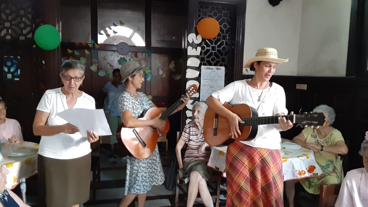 .Sisters Maria Isabel and Sara, from the community of the Servants of St. Joseph, play the guitar during a group birthday celebration at the Home for Elders, Siervas de San José in Havana, Cuba (Courtesy of Home for Elders, Siervas de San José)