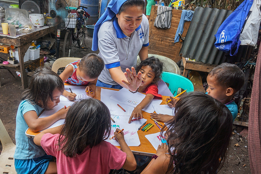 Salvatorian Sr. Cyrel Peralta is the book reading program and advocacy coordinator for the Salvatorian Pastoral Care for Children program in Metro Manila, the Philippines. The program's mobile library for book reading on the Gospel and children's rights has toured communities regularly since it began in 2004. (Courtesy of Salvatorian Pastoral Care for Children)