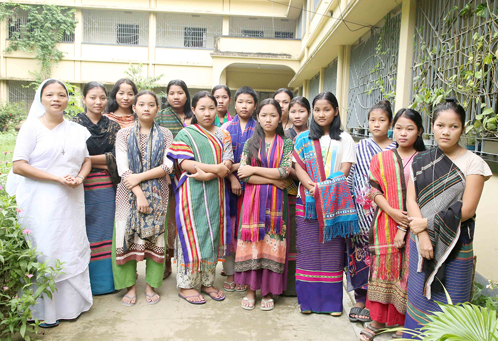 Little Handmaids of the Church Sr. Elizabeth Tripura and students of the Shanti Rani Girls Hostel are pictured at Alikadam Upazila in the Bandarban district, one of three districts in Bangladesh's Chittagong Hill Tracts. Tripura is in charge of the hostel. (Stephan Uttom Rozario)