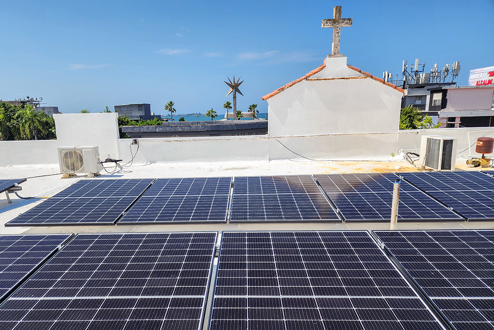 A new rooftop solar array at Nuestra Señora del Carmen in Cataño, a town bordering the San Juan Bay in Puerto Rico, will serve as a source of community resilience in the face of future climate disasters. (Courtesy of Lissette A. Avilés-Ríos) 