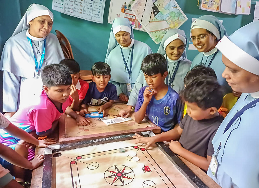 The Sisters of the Destitute team, headed by Sr. Aneesha Arackal (right), organizes play therapy for children affected by the landslides in the Wayanad district of the southwestern Indian state of Kerala. (Courtesy of Aneesha Arackal)