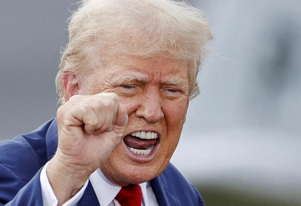 Republican presidential nominee and former U.S. President Donald Trump gestures during a campaign rally, at the North Carolina Aviation Museum & Hall of Fame Aug. 21 in Asheboro. (OSV News/Reuters/Jonathan Drake)