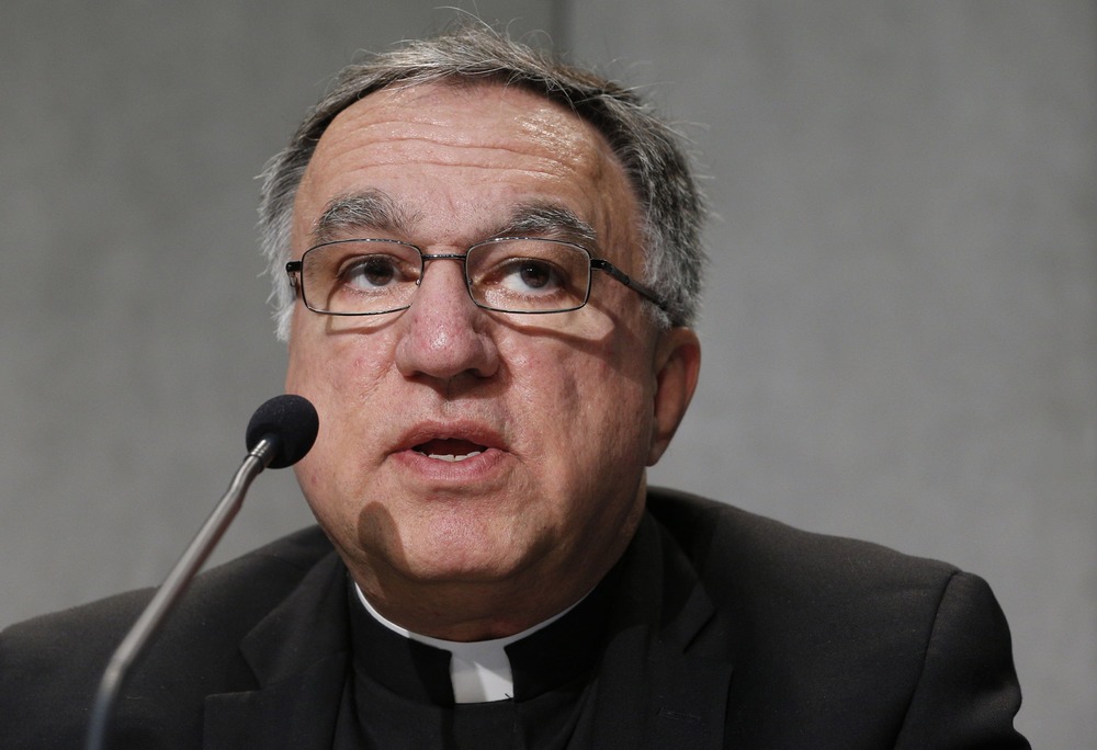 Close-up of Rosica in front of a microphone. 