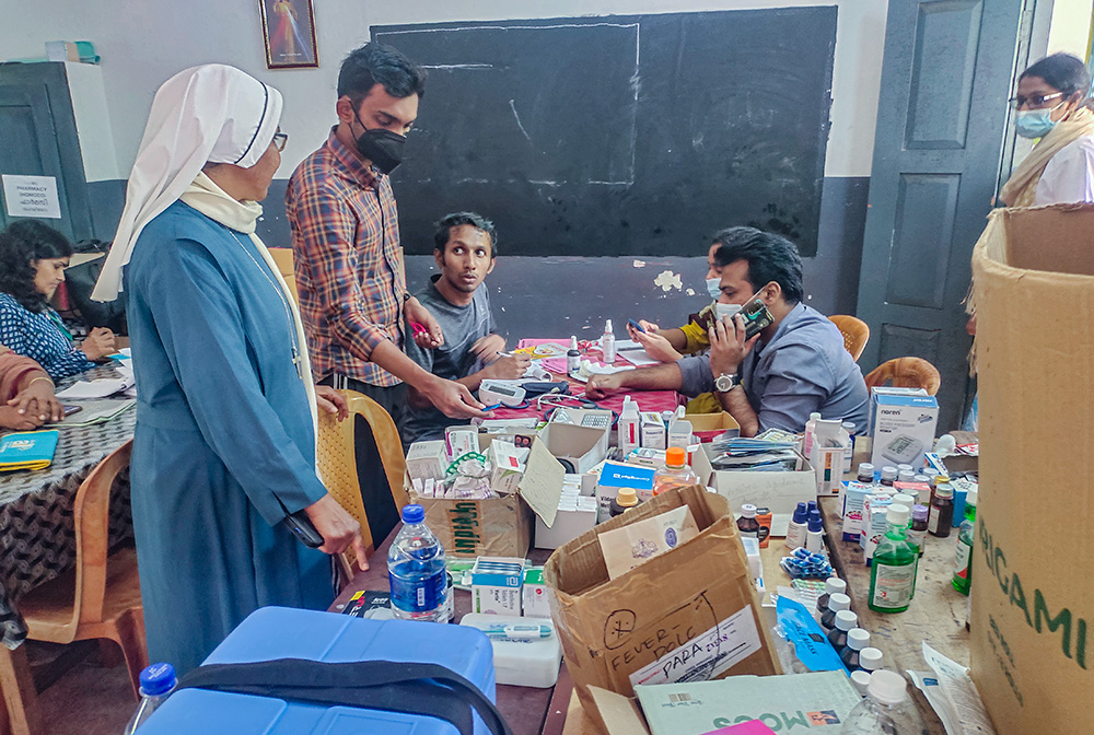 Maria Bambina Sr. Luxy James briefs a medical team at St. Joseph's camp in Meppadi, a town in the Wayanad district of Kerala, southwestern India. (Thomas Scaria)