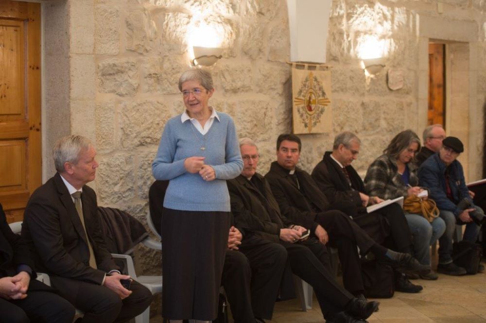 Sr. Hildegard Enzenhofer speaks with a group of visiting bishops.