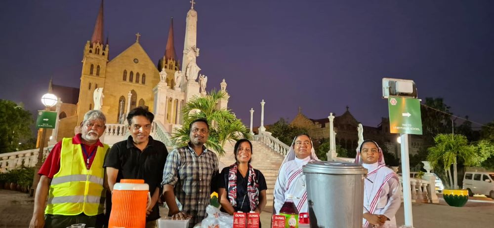 Franciscan Missionaries of Christ the King and Catholic volunteers work at a sabeel stand at St. Patrick's Cathedral in Karachi, Pakistan.