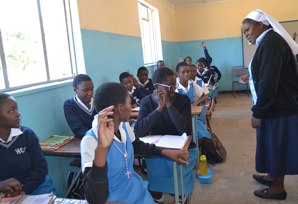 Sr. Bibian Mbao engages her grade eight students at Holy Cross Girls Secondary School in Mongu, Zambia. (Derrick Silimina)