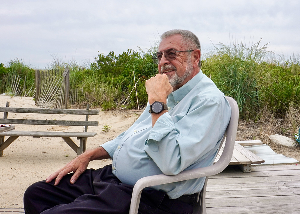 Fr. Ed Reading on a day off at his house on the Jersey Shore in July (Camillo Barone)