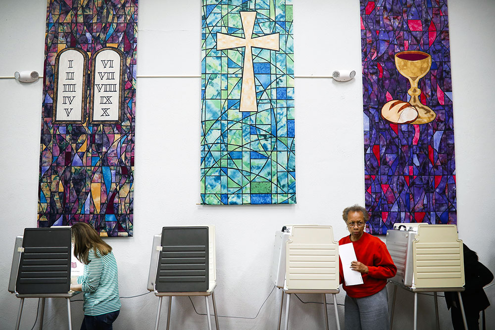 Voters fill out ballots at a polling place inside the Pleasant Ridge Presbyterian Church on Election Day, Nov. 8, 2016, in Cincinnati. (RNS/AP/John Minchillo)