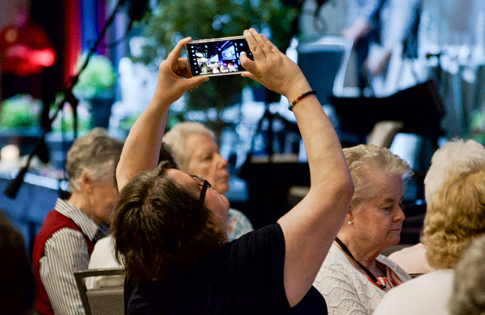 St. Joseph of Peace Sr. Susan Francois takes a photo Aug. 15 at the Leadership Conference of Women Religious assembly in Orlando, Florida. (GSR photo/Dan Stockman)