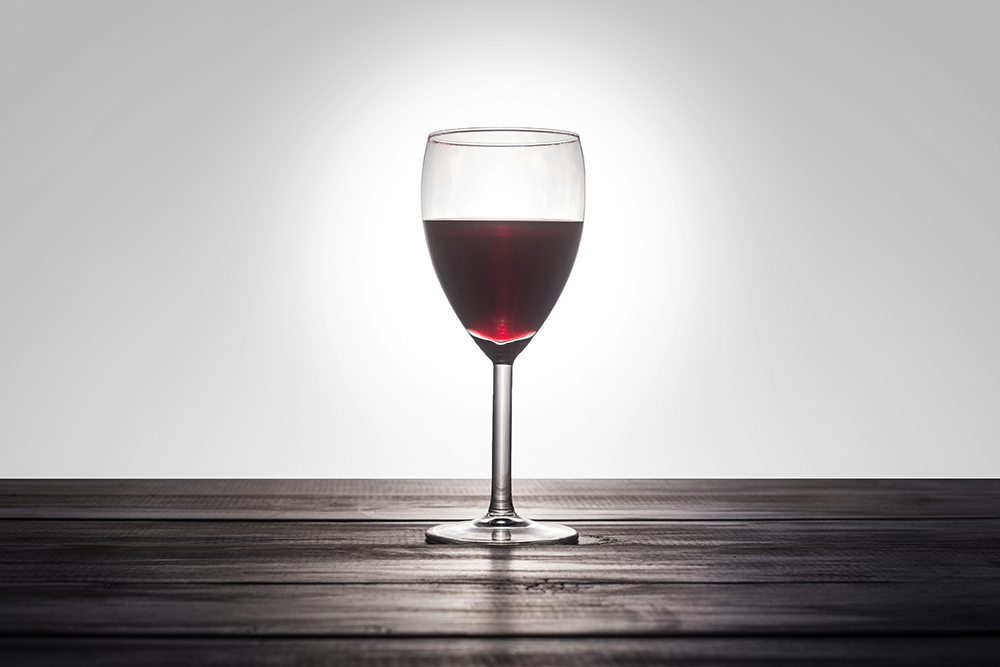 A single glass of red wine (Unsplash/Patrick Fore)