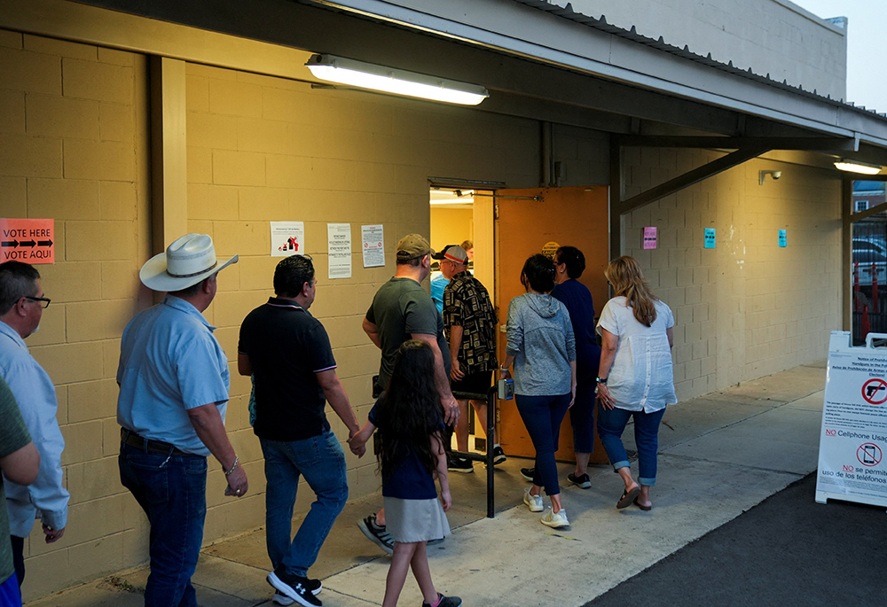 People stand in a line to vote shortly before the polls close in Edinburg, Texas, during the Super Tuesday primary election March 5, 2024. (OSV News/Reuters/Cheney Orr)