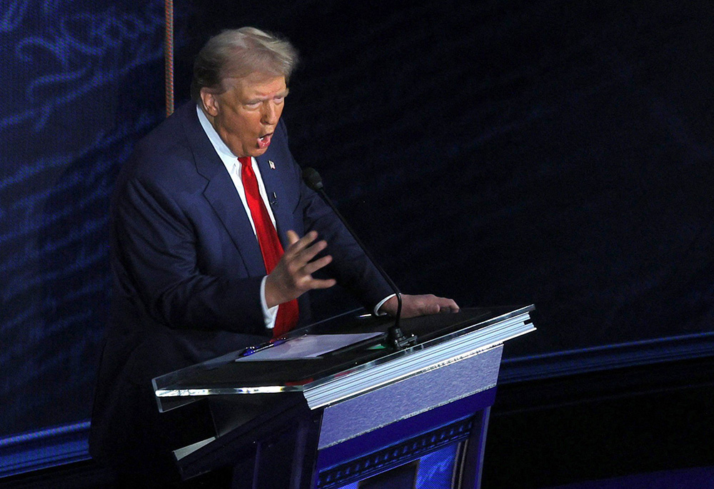 Former U.S. President Donald Trump, the Republican presidential candidate, gestures as he takes part in the first presidential debate with Vice President Kamala Harris, the Democratic presidential candidate, at the National Constitution Center Sept. 10 in Philadelphia. (OSV News/Reuters/Brian Snyder)