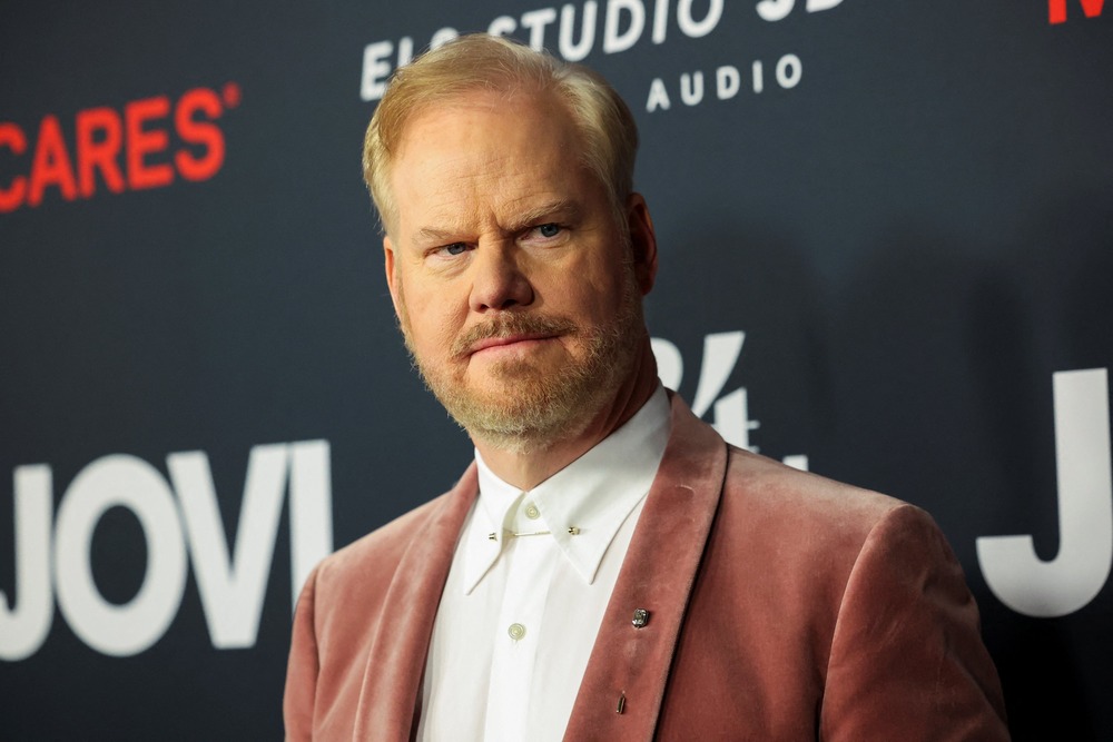 Gaffigan standing against photo-op.