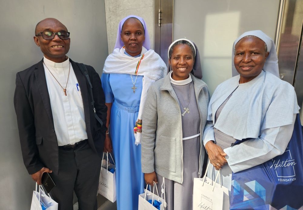 Summit of the Future participants included, from left, Jesuit Fr. Charles Chilufya, representing  the Bakhita Partnership for Education; and Srs. Hedwig Muse, Nelly Chisense and Jane Frances Kabagaaju. (Chris Herlinger)