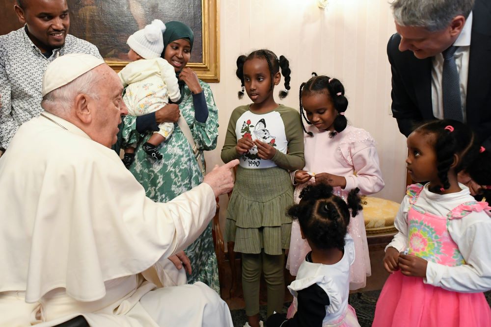 Pope Francis greets a Muslim family from Djibouti on Brussels.