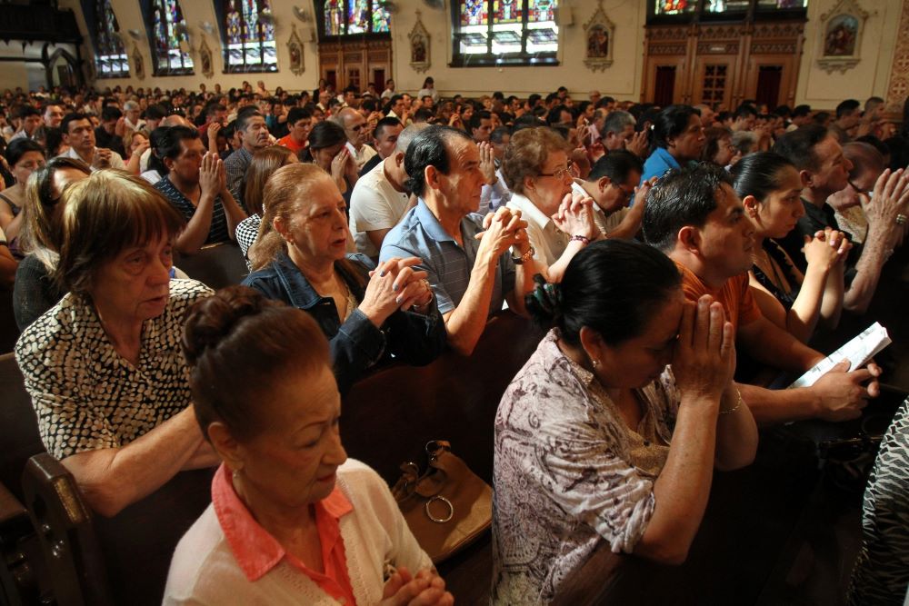 People pray during a Mass for immigration reform at Our Lady of Sorrows Church in the Corona neighborhood of the New York borough of Queens. People pray during a Mass for immigration reform at Our Lady of Sorrows Church in the Corona neighborhood of the New York borough of Queens.