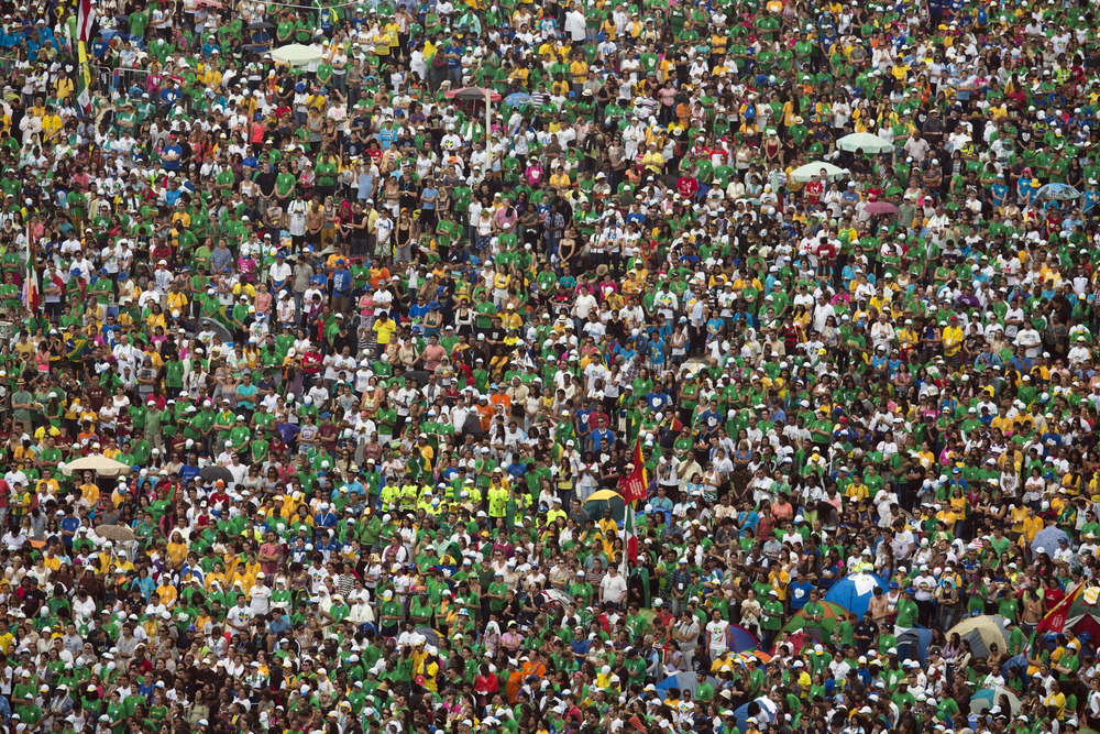 Aerial view of enormous crowd; individuals virtually indiscernible.   