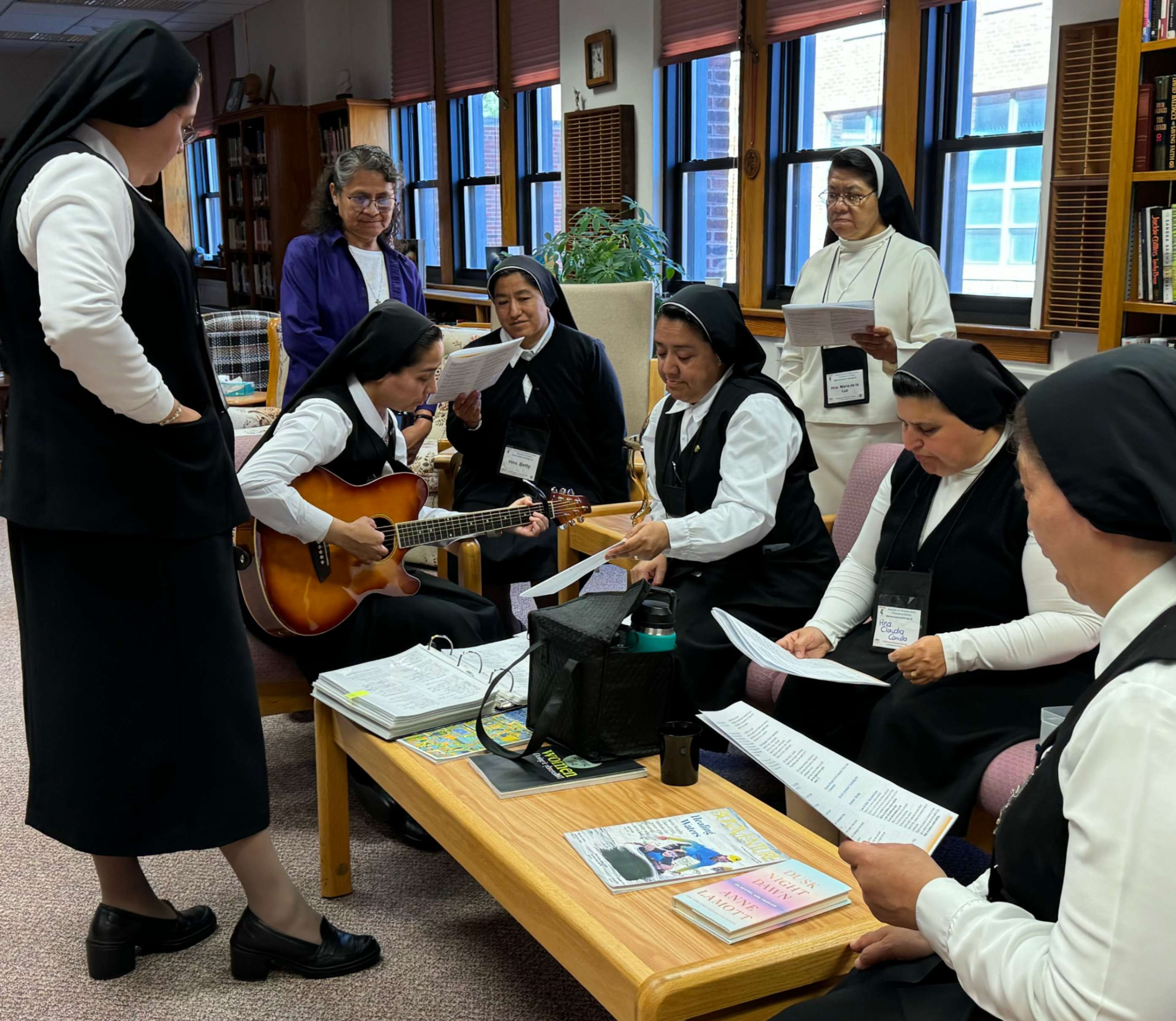 Sr. Maria de Jesus Bringas, left, a member of the Sisters of Charity of the Incarnate Word, and Sr. Elizabeth Ann Guerrero, a Missionary Catechist of Divine Providence, take part in an icebreaker Sept. 2 at the Mother of Good Counsel Convent.