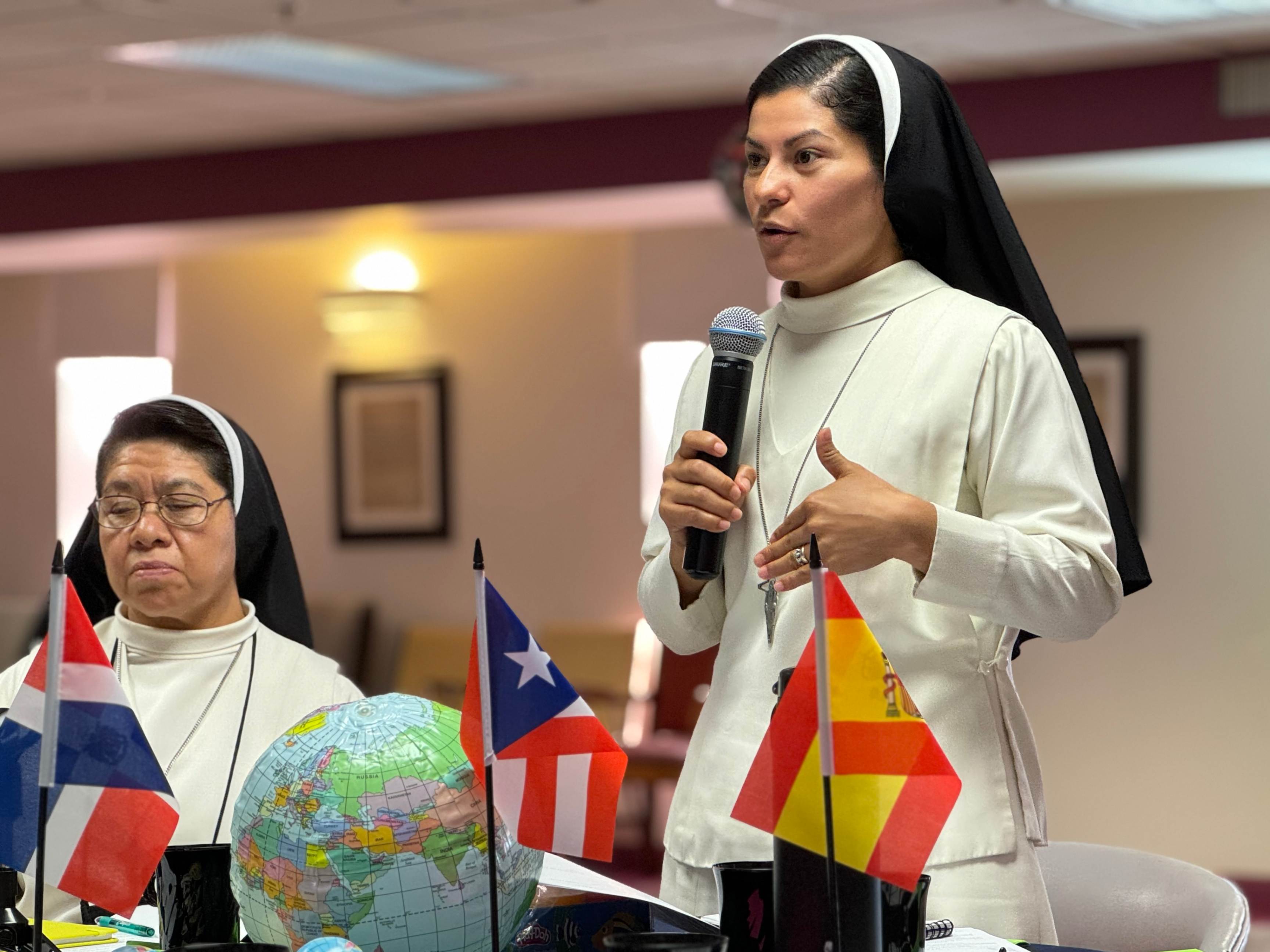 Sisters practice a hymn Sept. 2 before Mass at the Mother of Good Counsel Convent in Chicago. 