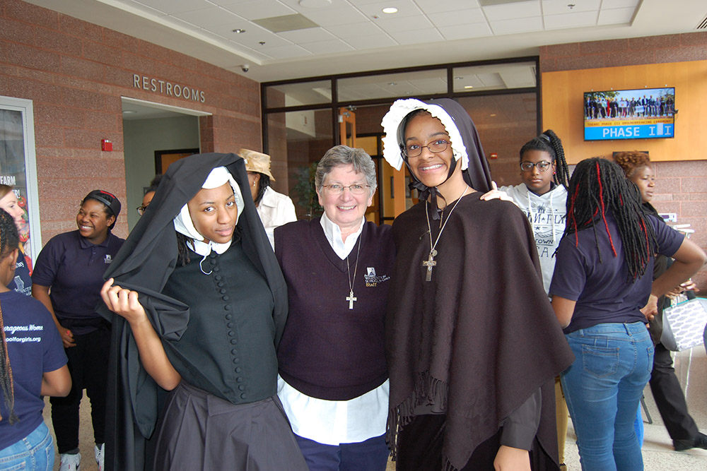 Sr. Mary Bourdon (center), a member of the Religious of Jesus and Mary, co-founded the Washington School for Girls, which helps provide equal access to high-quality education in Washington, D.C. (Courtesy of Washington School for Girls)