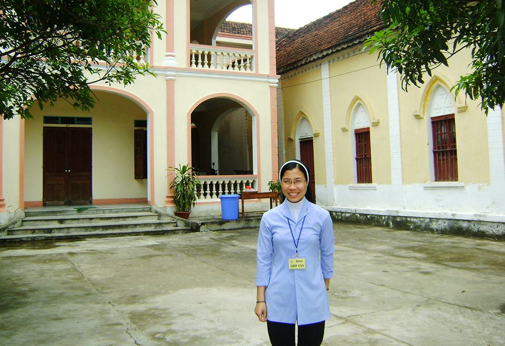 Lovers of the Holy Cross of Vinh Sr. Anna Truong Hoai Anh, in front of her convent in Ha Tinh province, Vietnam, on June 28 (GSR photo)